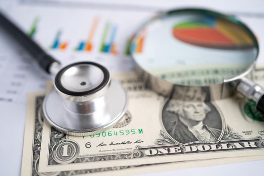 Stethoscope on chart graph paper, finance, account, statistic, analytic economy Business concept.