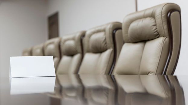 Closeup of on table in empty corporate conference room before business meeting in office