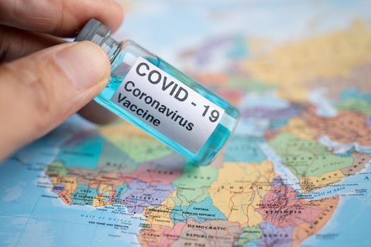 Bangkok, Thailand - July 1, 2021, Coronavirus Covid-19 vaccine on Africa map, development medical for doctor use to treat pneumonia illness patients.