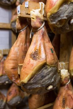 BOLOGNA, ITALY. May 02, 2018: Sorage of prosciutto in a ham factory in Bologna, Italy