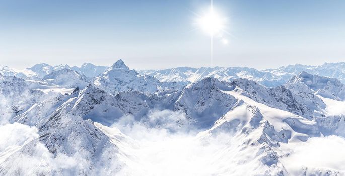 Panorama of winter mountains in Caucasus region, Russia, view from Elbrus mountain