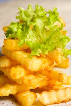 Fresh fried wavy french fries tower