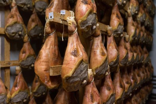 BOLOGNA, ITALY. May 02, 2018: Sorage of prosciutto in a ham factory in Bologna, Italy