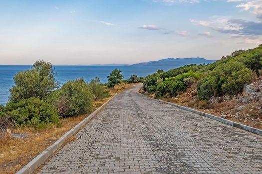 kusadasi,aydin,turkey- july 24,2021.seascape, green nature and sportive trekking paths in kusadasi in early morning time and summer season.