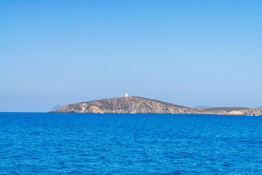 Beautiful view of the southern Sardinian sea. Note the historic Saracen tower on the rock formations.