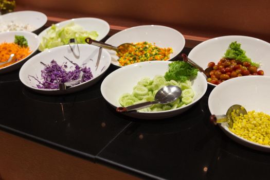 Variety of fresh salads in a buffet