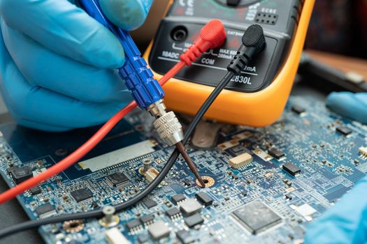 technician repairing inside of hard disk by soldering iron. Integrated Circuit. the concept of data, hardware, technician and technology.