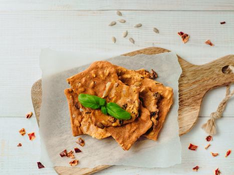 Gluten-freen crispbreads made of buskwheat flour. Green buckwheat flour smoked paprika sunflower seeds ingredients homemade baked crisp bread. Idea recipe snacks gluten free concept. Top view flat lay
