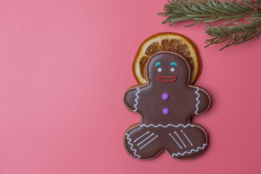 ginger cookies and a slice of orange on a pink background. High quality photo