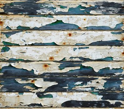 Wooden panels with peeling and worn paint