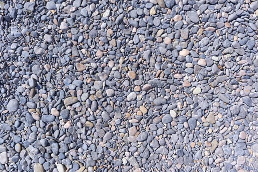 gray sea pebbles close-up as a background. High quality photo