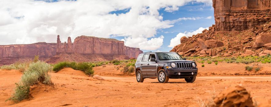 MONUMENT VALLEY, UTAH, USA - MAY 25, 2015 - Offroading through the Monument Valley in a Jeep Patriot. Jeep Patriot is a four-wheel drive off-road and sport utility vehicle (SUV), manufactured by American automaker Chrysler.