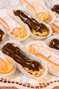 Mini vanilla eclairs with chocolate frosting