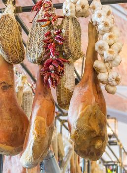 Spanish hamon close up hanging in restaurant, prosciutto meat