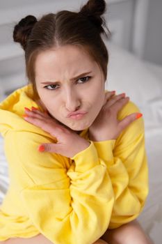 charming sweet young woman in yellow hoodie.