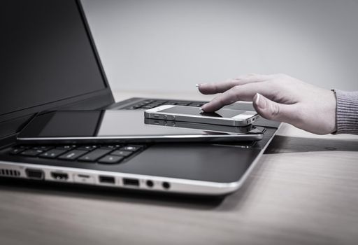 Modern electronic devices - laptop, tablet and telephone