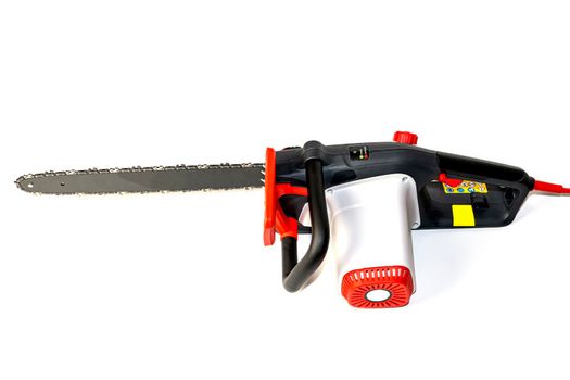 Chain saw on wood on a white background. High quality photo