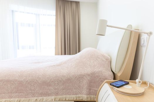 Wireless telephone charging in bedroom