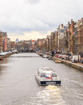 AMSTERDAM, NETHERLANDS - MARCH 15: Streets of the city with canals, on March 15, 2014 in Amsterdam