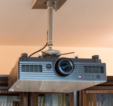 computer projector hanging in a conference hall