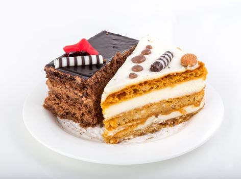 Two pieces of tasty cake on white saucer