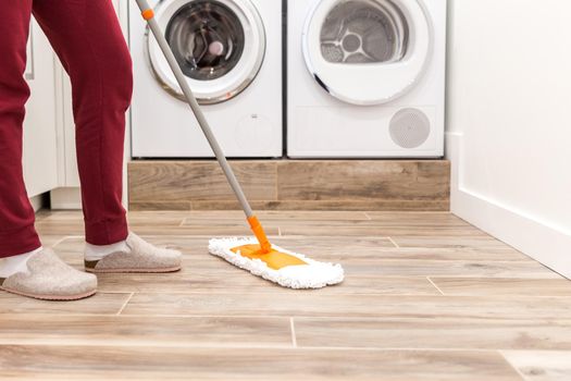 Cleaning floor in laundry room
