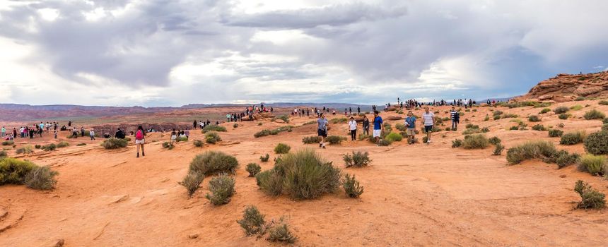 PAGE, ARIZONA - MAY 25: Hikers at Horseshoe Bend on May 25, 2015 in Page AZ,USA. Thousands of people from all over the world visit this unique place every year.