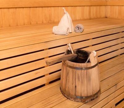 Inside view of traditional sauna with some equipment