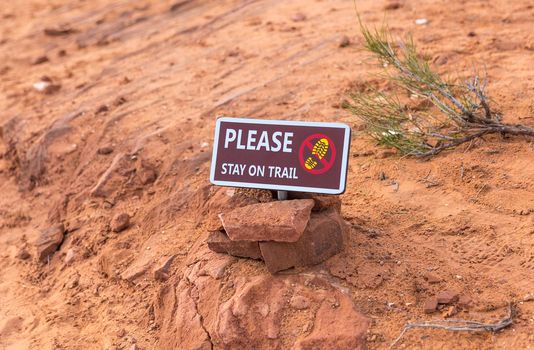 Please stay on trail Sign Warning that Hikers should stay on The Trail for Their Protection