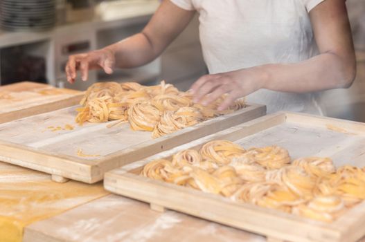 Making homemade italian pasta tagliatelle