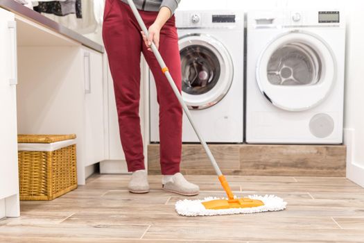 Cleaning floor in laundry room