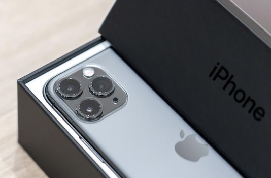 Moscow, Russia - September 24, 2019: new Apple iPhone 11 pro in box on wooden background