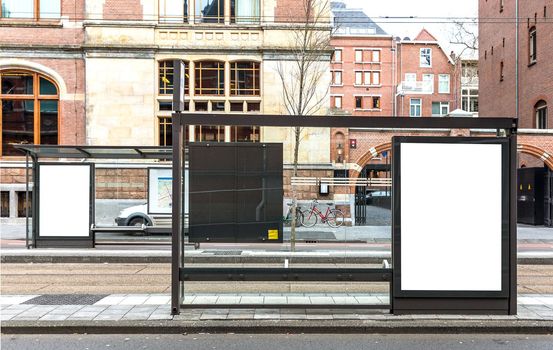 Blank billboard on a roadside in european town