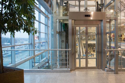 modern silver elevator in moscow airport Domodedovo