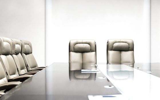 conference room with wooden table and beige leather armchairs