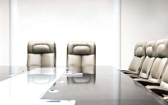 conference room with wooden table and beige leather armchairs