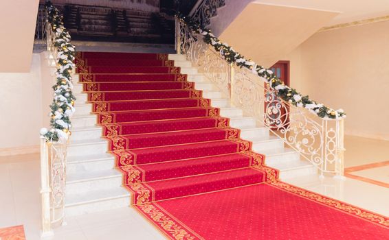 Classic red carpet on a marble staircase