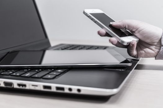 Modern electronic devices - laptop, tablet and telephone