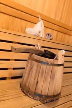 Inside view of traditional sauna with some equipment