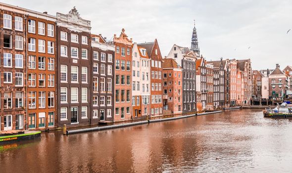 AMSTERDAM, NETHERLANDS - MARCH 15: Streets of the city with canals, on March 15, 2014 in Amsterdam