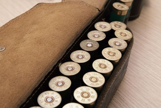 An old cartridge leather belt with shotgun shells
