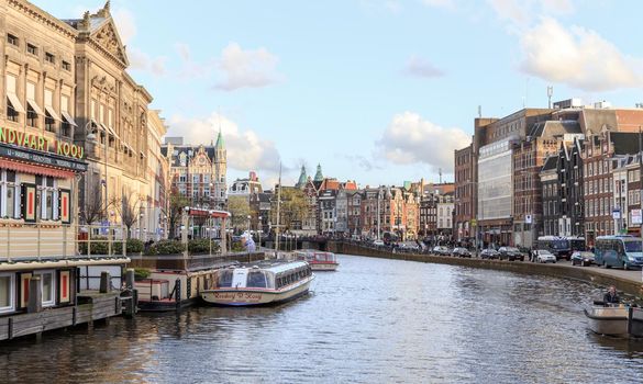 AMSTERDAM, NETHERLANDS - MARCH 15: Streets of the city with canals, on March 15, 2014 in Amsterdam