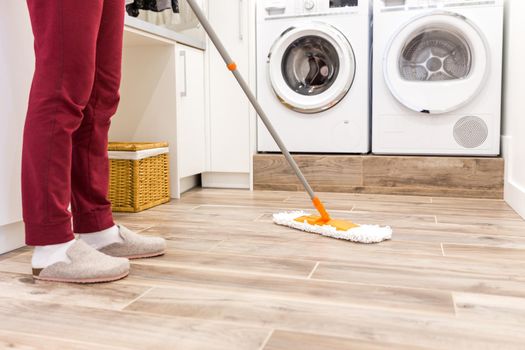 Cleaning floor in laundry room