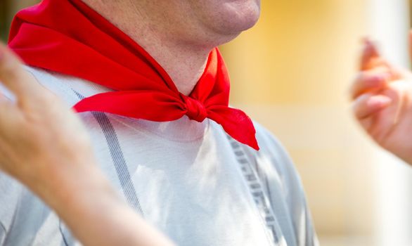 Man wearing Red silk tied neckerchief