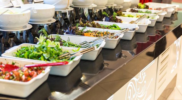 Variety of fresh salads in a buffet