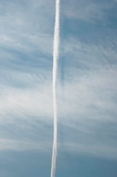 Beautiful sky background. Unusual cirrus clouds in the blue sky