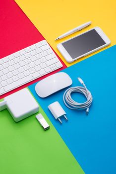 Well organised white office objects on colorful background