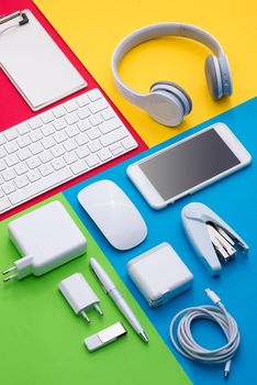 Well organised white office objects on colorful background