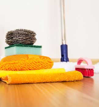 set of cleaning equipment on a wooden floor