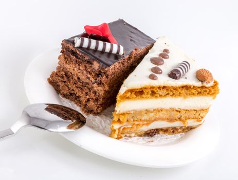 Two pieces of tasty cake on white saucer